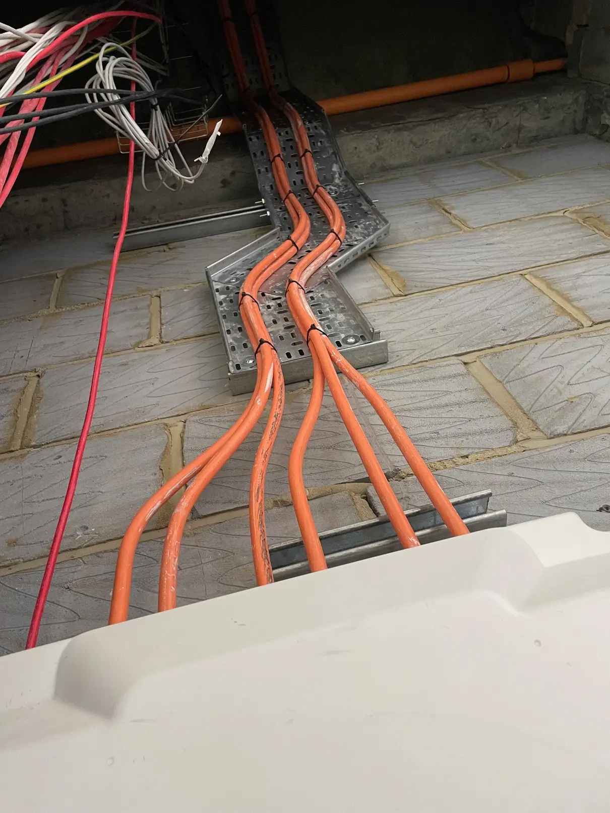 Mains cables installed through a high-rise electrical riser at Sylvester Street